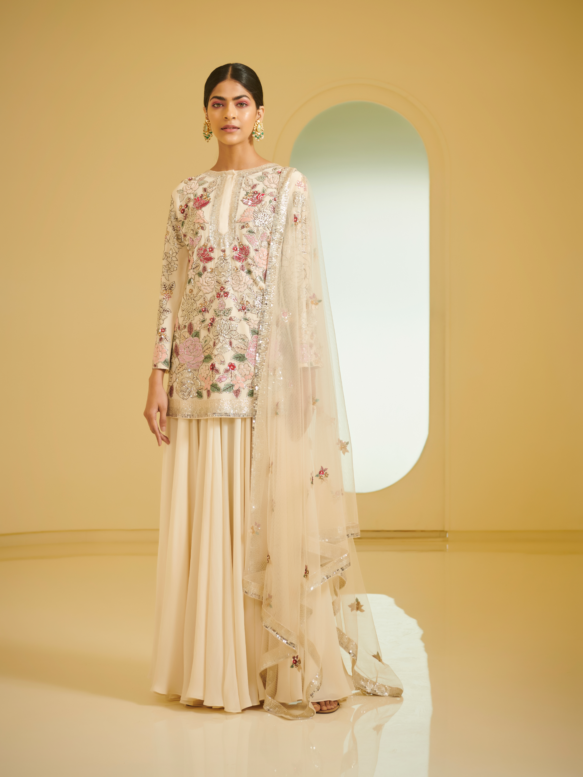 Ivory Embroidered Kurta Styled With Sharara And Dupatta