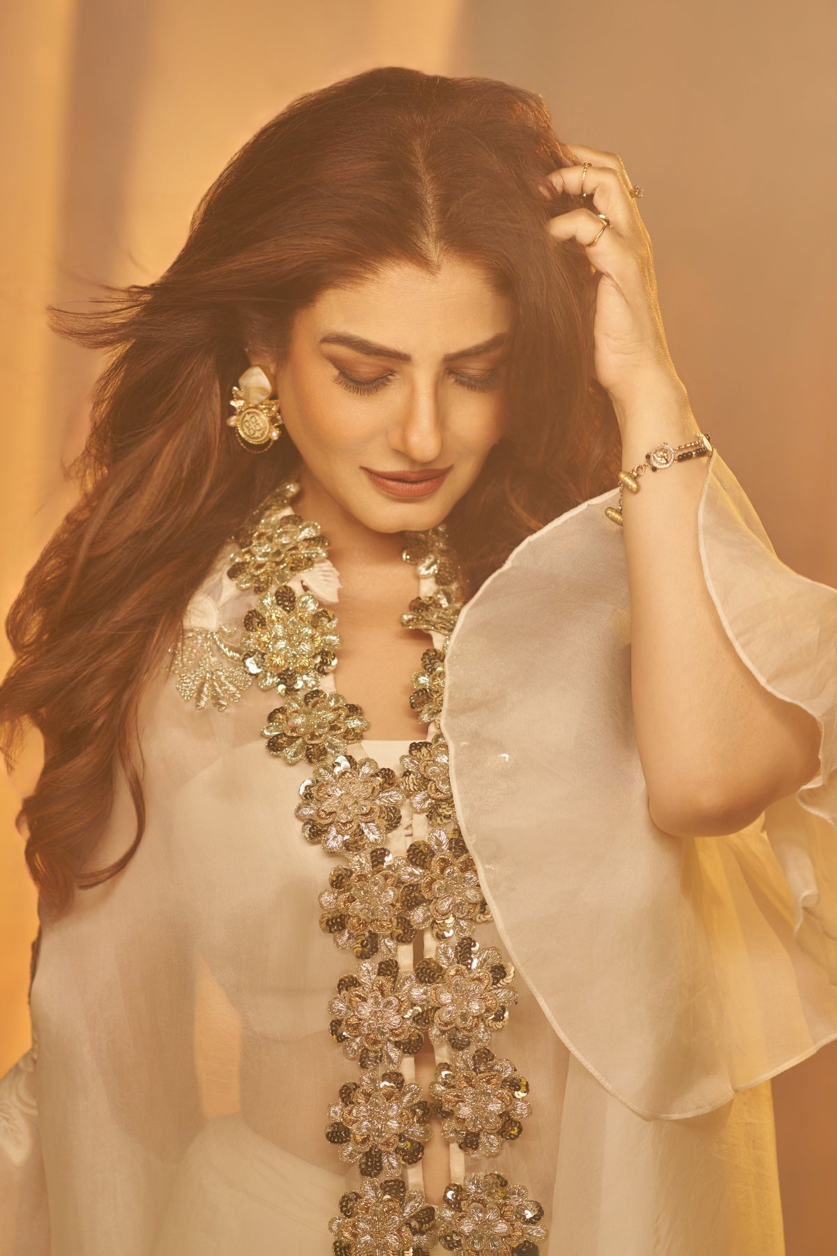 Raveena Tandon In Ivory Bloom Cape Set